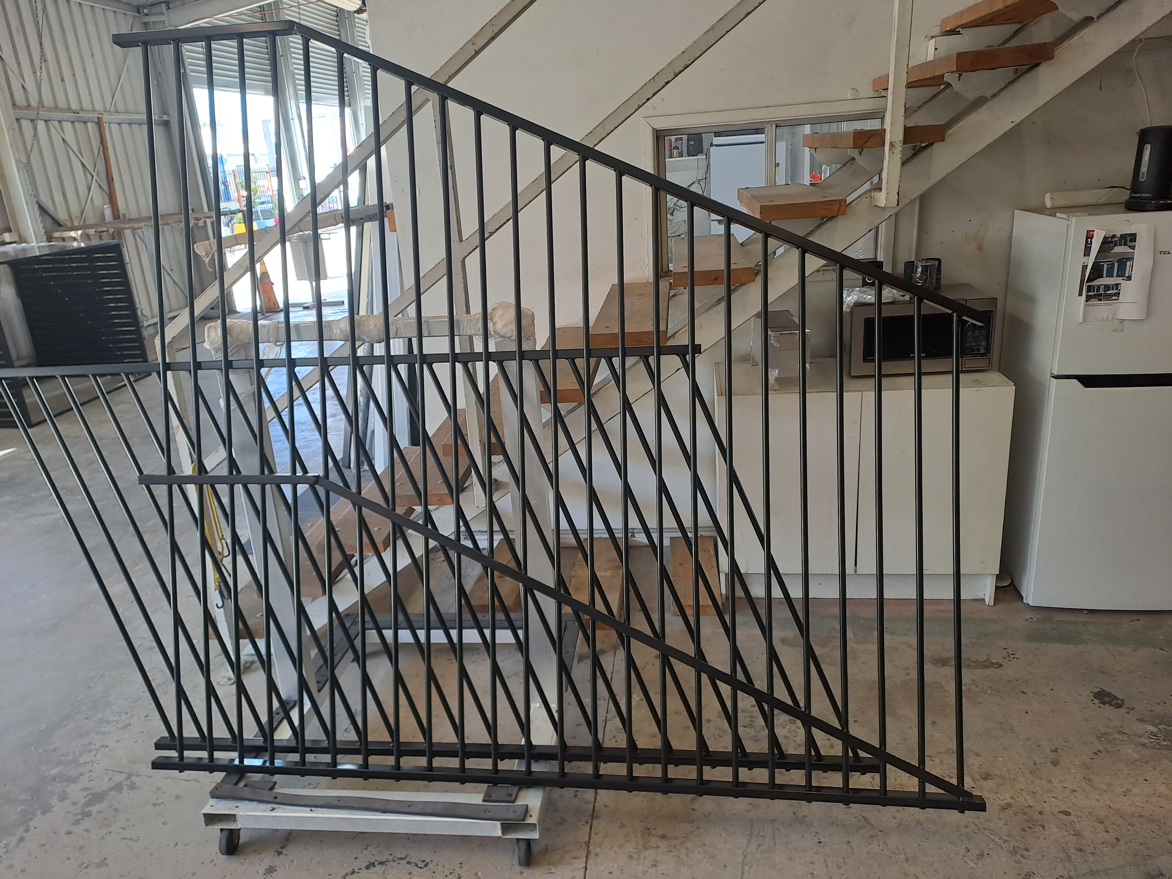 Black tubular sliding driveway gate with automation motor installed on site - Gateflex, Caboolture